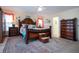 Elegantly furnished main bedroom with ornate bed frame and tropical bedding at 2016 E View Dr, Sun City Center, FL 33573