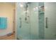Walk-in shower features glass enclosure and a built-in niche at 2016 E View Dr, Sun City Center, FL 33573