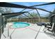 View of the enclosed pool, patio furniture, and landscaped backyard at 2041 Shadow Pine Dr, Brandon, FL 33511