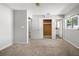 Bright bedroom with closet, ensuite bath, carpet, and neutral paint at 2391 66Th S Ter, St Petersburg, FL 33712