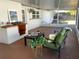 Screened-in patio featuring an outdoor chair, table, and built-in brick outdoor cooking center at 2391 66Th S Ter, St Petersburg, FL 33712