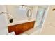Bathroom featuring wood cabinets, white countertops, and tiled floors at 2612 Pearce Dr # 211, Clearwater, FL 33764