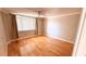 Bedroom featuring hardwood floors, neutral paint and a large window at 2612 Pearce Dr # 211, Clearwater, FL 33764