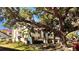 Beautiful multi-story condo with well-manicured landscaping and mature trees creating a serene environment at 2612 Pearce Dr # 211, Clearwater, FL 33764