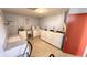 A well-lit laundry room with multiple washing machines and folding area at 2612 Pearce Dr # 211, Clearwater, FL 33764