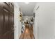 Bright foyer with wood floors leads to an open concept living area at 3019 Royal Tuscan Ln, Valrico, FL 33594