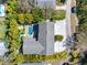 Overhead shot of lush property, showing a private pool, spa, and well-manicured landscaping at 314 Pennsylvania Ave, Palm Harbor, FL 34683