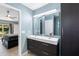 Modern bathroom with double vanity sink, and bedroom view at 314 Pennsylvania Ave, Palm Harbor, FL 34683