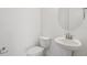 Clean bathroom with toilet and pedestal sink at 31857 Anchor Point Dr, Wesley Chapel, FL 33545