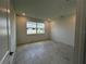Bright, sunlit bedroom with tiled floors and neutral walls, offering a clean and modern space at 31857 Anchor Point Dr, Wesley Chapel, FL 33545