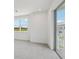 Bright bedroom featuring a balcony with great views of the neighborhood at 31857 Anchor Point Dr, Wesley Chapel, FL 33545