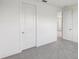 This bright bedroom showcases plush carpeting and white interior doors at 31857 Anchor Point Dr, Wesley Chapel, FL 33545