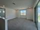 Comfortable bonus room with plush carpeting, large window and access to a private balcony at 31857 Anchor Point Dr, Wesley Chapel, FL 33545