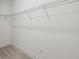 Carpeted walk-in closet with wire shelving, ready for storage solutions at 31857 Anchor Point Dr, Wesley Chapel, FL 33545