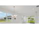 Dining area filled with natural light and view of the living room and access to the backyard at 31857 Anchor Point Dr, Wesley Chapel, FL 33545