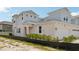 Charming townhome features a two-car garage and neutral color scheme with well maintained landscaping at 31857 Anchor Point Dr, Wesley Chapel, FL 33545