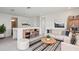 Loft area is virtually staged with furniture including sofa and bookshelf at 31857 Anchor Point Dr, Wesley Chapel, FL 33545
