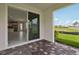Covered patio transitions to an open-concept floor plan with natural light and outdoor views at 31857 Anchor Point Dr, Wesley Chapel, FL 33545