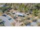 Aerial view of a community playground with slides, parking, benches, and mature trees in a well-maintained area at 32673 Pez Landing Ln, Wesley Chapel, FL 33543