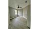 Bedroom features one window, light gray walls, wood-look flooring, and a modern ceiling fan at 3413 N 72Nd St, Tampa, FL 33619