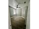 Bedroom features one window, light gray walls, wood-look flooring, and a modern ceiling fan at 3413 N 72Nd St, Tampa, FL 33619