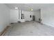 Spacious garage with white walls, concrete floor, overhead lighting, and garage door at 3413 N 72Nd St, Tampa, FL 33619