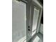 Close up view of the double French doors that lead to the home's patio, featuring blinds for adjustable natural light at 3413 N 72Nd St, Tampa, FL 33619