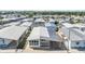 Overview of the community showcasing well-maintained homes and landscaping from above at 37838 Granada Ave, Zephyrhills, FL 33541