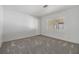 Cozy bedroom featuring neutral walls, a window for natural light, and plush carpeting for comfort at 37838 Granada Ave, Zephyrhills, FL 33541