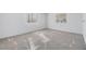 Inviting bedroom with neutral carpet and ample natural light from two windows at 37838 Granada Ave, Zephyrhills, FL 33541