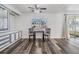 Cozy dining area with natural light, modern floors, and built-in display cabinet at 37838 Granada Ave, Zephyrhills, FL 33541