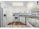 Well-equipped kitchen with ample counter space, modern appliances, and stylish backsplash at 37838 Granada Ave, Zephyrhills, FL 33541