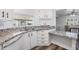 Well-lit kitchen with sleek countertops, stainless steel sink, and ample cabinet space at 37838 Granada Ave, Zephyrhills, FL 33541