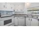 Modern kitchen with white appliances and ample counter space at 37838 Granada Ave, Zephyrhills, FL 33541