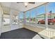 Enclosed patio featuring ample windows and access to the outside at 37838 Granada Ave, Zephyrhills, FL 33541