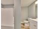 Bathroom featuring a combination tub and shower, toilet, and modern vanity at 39809 Pretty Pond Rd, Zephyrhills, FL 33540