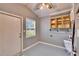 Functional laundry room with a utility sink, and storage cabinets at 39809 Pretty Pond Rd, Zephyrhills, FL 33540
