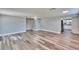 Open-concept layout featuring new floors and abundant light flowing into the kitchen and living areas at 39809 Pretty Pond Rd, Zephyrhills, FL 33540