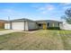 Attractive single-Gathering home with a yellow front door, two-car garage and well-kept lawn at 6401 Elmhurst Ct, Pinellas Park, FL 33782