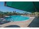 Beautiful outdoor pool with ample seating and shade, perfect for relaxing and enjoying the sunny surroundings at 658 Masterpiece Dr # 186, Sun City Center, FL 33573