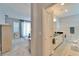 A combined view of a bedroom and a bathroom with double sinks and a granite countertop at 6906 Muncaster Ct, Tampa, FL 33625