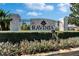 Stone Ravinia entrance sign with manicured landscaping and wrought iron gate at 6906 Muncaster Ct, Tampa, FL 33625