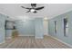 Bright living room featuring wood flooring, ceiling fan, and natural light at 718 Lyndhurst St # 904, Dunedin, FL 34698