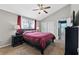 This bedroom features neutral walls, a ceiling fan, carpet flooring, and a window letting in natural light at 720 Gasparino Ct, Seffner, FL 33584