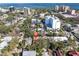 Aerial view of the neighborhood with lush greenery and a glimpse of the bay at 732 Oak Ne St, St Petersburg, FL 33701