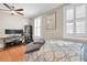 Bedroom featuring hardwood floors, crown molding, a ceiling fan, and lots of natural light at 732 Oak Ne St, St Petersburg, FL 33701