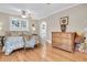 Bright bedroom featuring hardwood floors, crown molding, a ceiling fan and lots of natural light at 732 Oak Ne St, St Petersburg, FL 33701