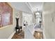 Bright upstairs hallway with white railing and views into other rooms through French doors at 732 Oak Ne St, St Petersburg, FL 33701