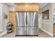 Modern kitchen featuring stainless steel refrigerator, wood cabinets, and tiled flooring at 732 Oak Ne St, St Petersburg, FL 33701