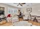 Cozy living room with hardwood floors, area rug, and abundant natural light at 732 Oak Ne St, St Petersburg, FL 33701